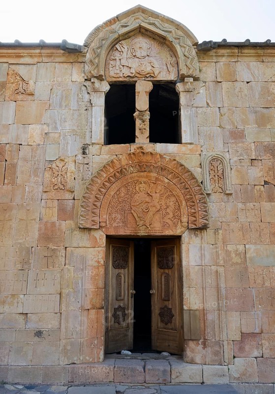 Historic stone wall with carved door and religious symbols, Noravank monastery, Surb Karapet Baptist Church, Noravank, Vayots Dzor province, Vayots Dzor, Armenia, Caucasus