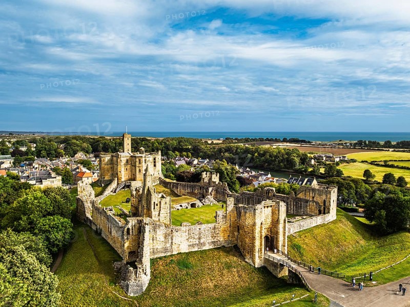 Warkworth Castle over River Coquet from a drone, Warkworth, Northumberland, England, United Kingdom