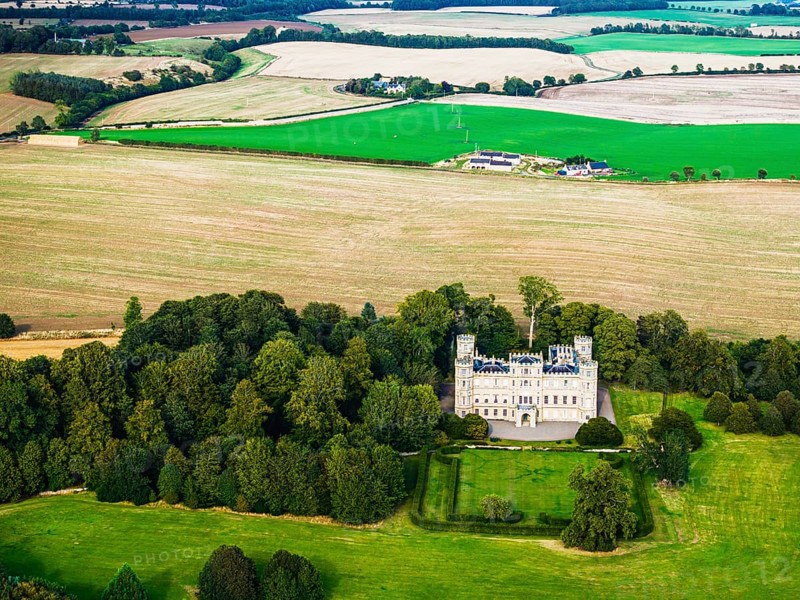 Wedderburn Castle and Barns over fields from a drone, Duns, Berwickshire, Scotland, UK