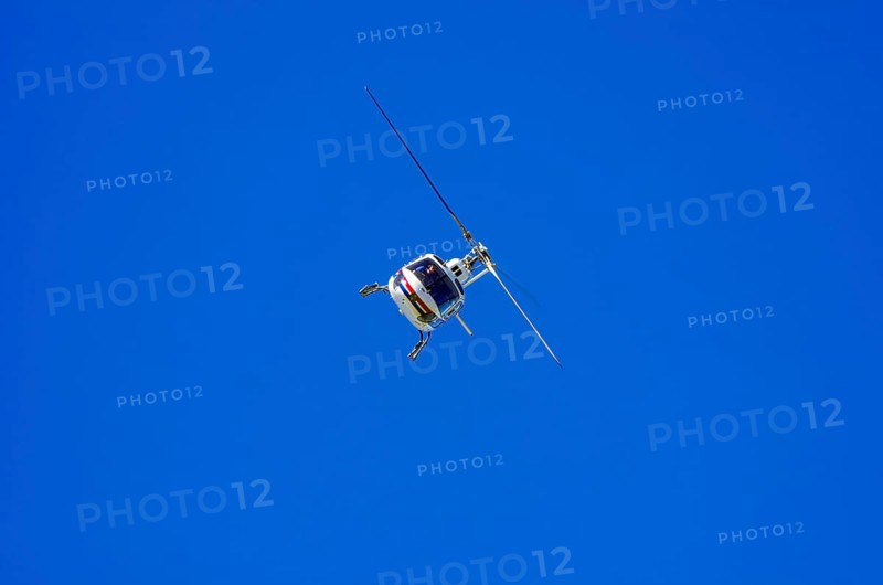 An Aerospatiale AS-350 BA Ecureuil helicopter, registration D-HAAN, from Meravo Air Company during a flight demonstration as part of an air show on Rossfeld in Metzingen-Glems, Baden-Württemberg, Germany, for editorial use only