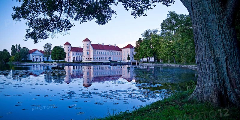Rheinsberg Castle, lakeside with Lake Grienerick at night, prime example of Friederician Rococo, Brandenburg, Germany