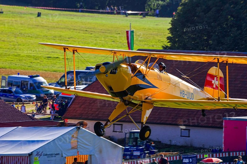 A biplane Bücker Bü 131 Jungmann with the registration HB-UUD during a flight demonstration as part of an air show on Rossfeld in Metzingen-Glems, Baden-Württemberg, Germany, for editorial use only