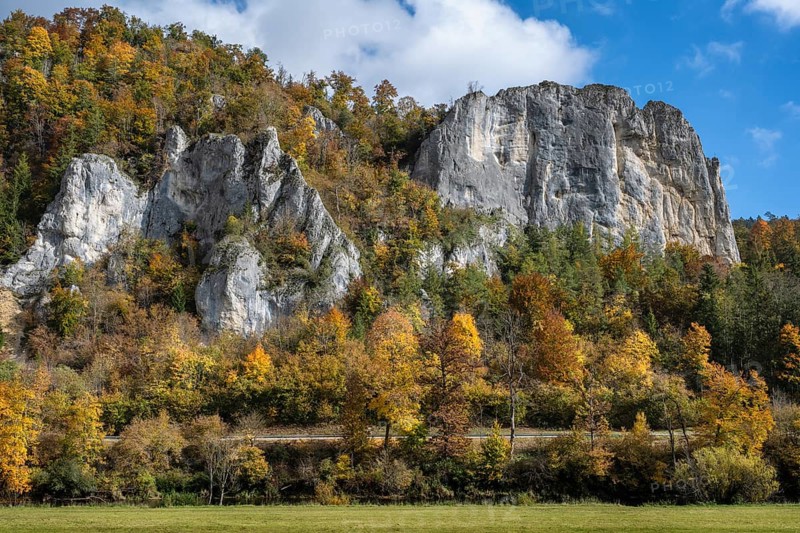 Distinctive Jurassic limestone cliffs in the upper Danube Valley, surrounded by autumn vegetation, on the right the raven rocks, Sigmaringen district, Baden-Württemberg, Germany