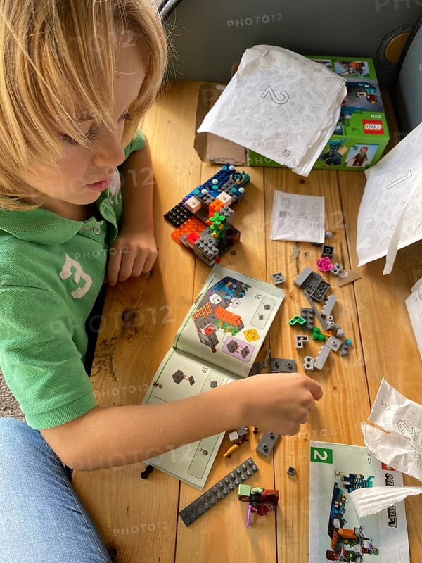 Child, boy, 7 years, blonde, playing with Lego, building kit, Stuttgart, Baden-Württemberg, Germany