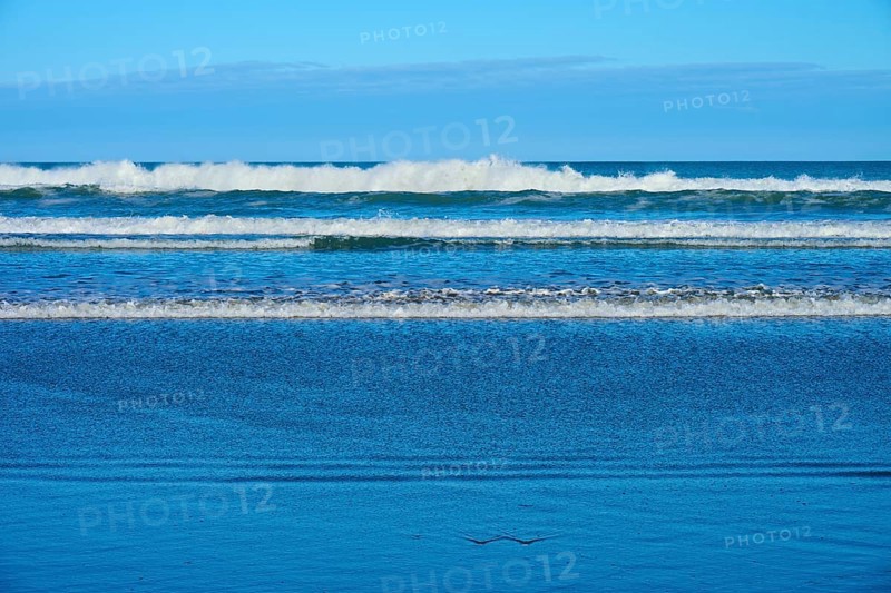 Gentle waves meet the beach, sky and sea in harmony, Spencer Park Beach, Spencerville, Christchurch, New Zealand South Island, New Zealand