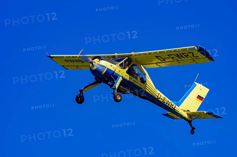 A PZL-104 Wilga-35A sport aircraft from Fliegerklub Kamenz with registration D-EWRZ during a flight demonstration as part of an air show on Rossfeld in Metzingen-Glems, Baden-Württemberg, Germany, for editorial use only