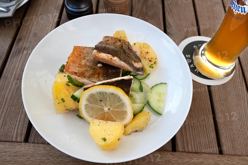 Fish fillet served with potatoes in a garden restaurant, Franconia, Bavaria, Germany