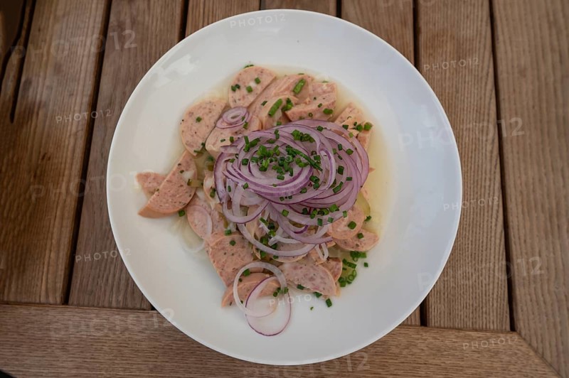 City sausage served with onions in a garden restaurant, Franconia, Bavaria, Germany
