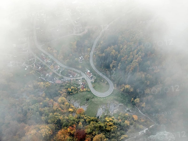 Aerial view of the viewpoint, shovels and Hausen Castle, also known as the Hausen ruins, surrounded by autumnal vegetation and clouds of fog on the village of Hausen in the valley in the Upper Danube Valley, Beuron, Sigmaringen district, Baden-Württemberg, Germany