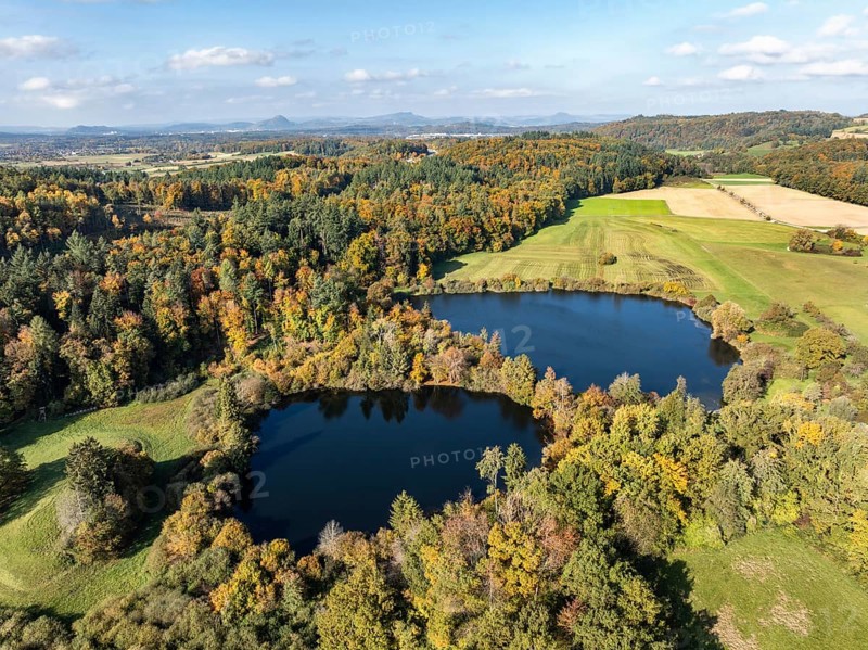 Aerial view of Lake Beech including Güttinger See, a swimming lake near Radolfzell am Lake Constance, on the horizon the Hegauberge Mountains, district of Constance, Baden-Württemberg, Germany