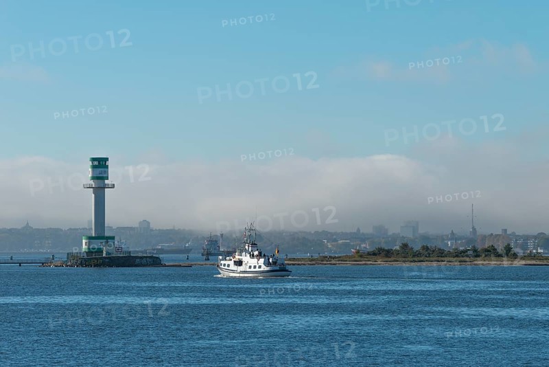 Green-white lighthouse Friedrichsort with city panorama of the state capital, Kiel Fjord, Kiel, haze bell, shipping, tower, architecture, landmark, orientation, navigation, shipping, blue sky, Schleswig-Holstein, Germany