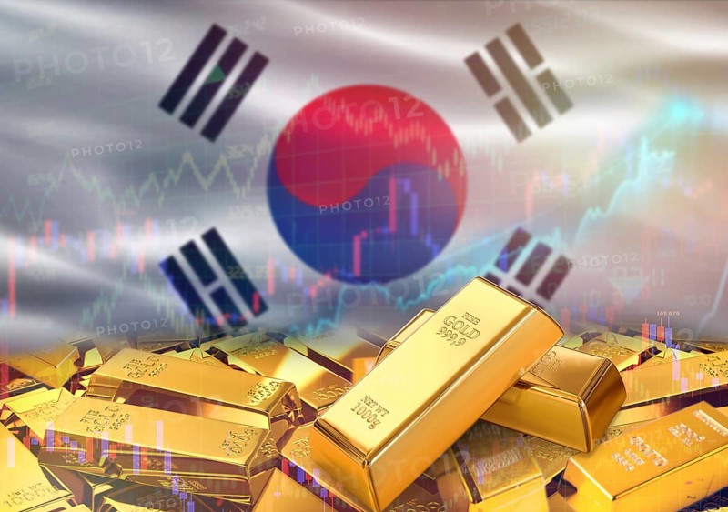 Gold bars on South Korea flag in background. Gold bars stacked on South Korean flag. Concept of South Korea gold reserves