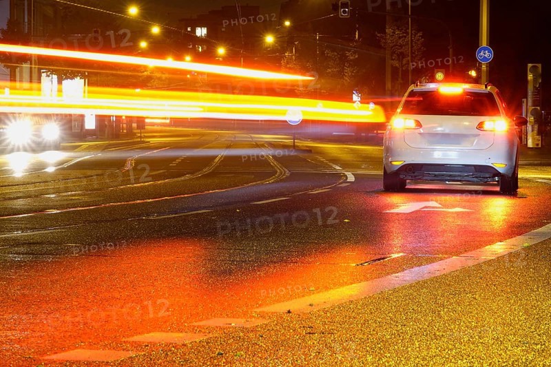 Road traffic at night and poor visibility in a city, autumn, Germany