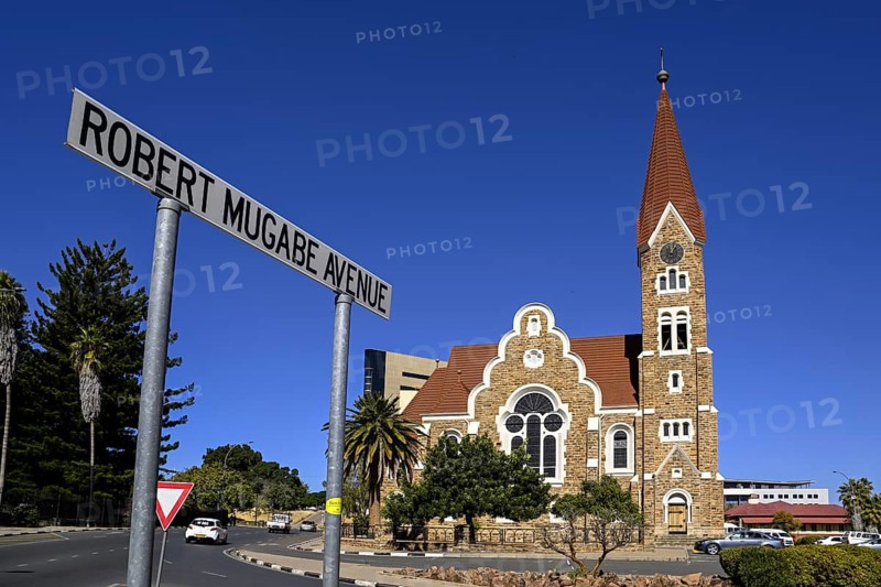 Robert Mugabe Avenue sign in front of the 1910 Evangelical Lutheran Christ Church, Windhoek, Khomas region, Namibia