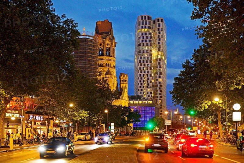 Budapester Straße with Kaiser Wilhelm Memorial Church and Upper West Tower in the evening, Charlottenburg, Berlin, Germany