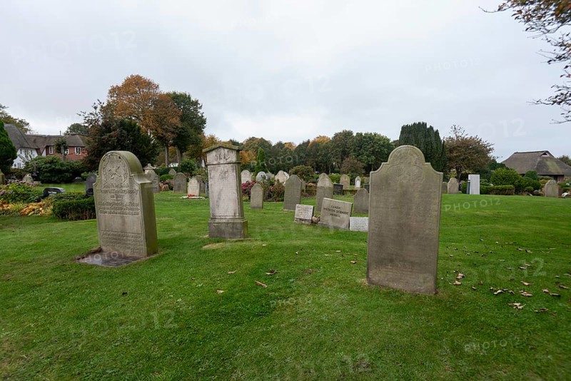 Cemetery of St John's Church with gravestones telling the story of seafarers, known as talking gravestones, Nieblum, Föhr Island, Schleswig-Holstein, Germany