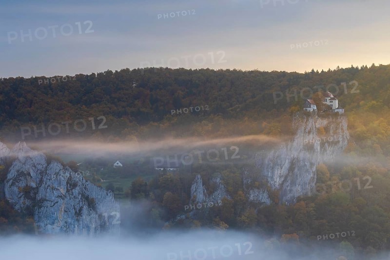 View from the Knopfmacherfelsen to Bronnen Castle, limestone rock, rock face, mixed forest, autumn colours, fog, autumn, Fridingen, Danube Valley, Upper Danube nature park Park, Baden-Württemberg, Germany