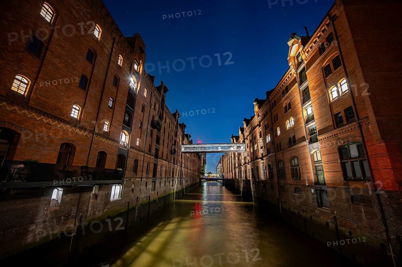 Illuminated warehouses in Hamburg's Speicherstadt, blue hour, Hamburg, Germany