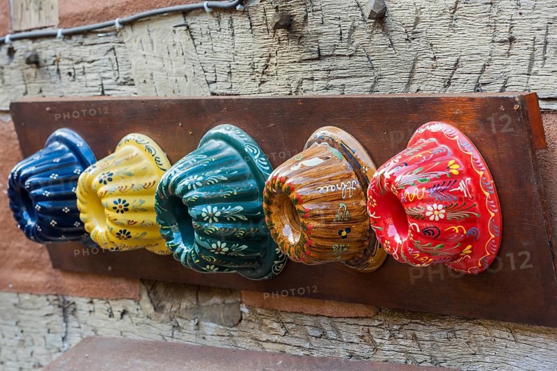 Traditional colourful Guglhupf cake tins from a bakery in Kaysersberg
