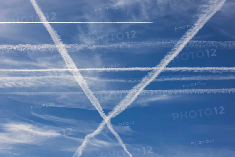Contrails in the sky. These artificial clouds are created from the exhaust fumes of aeroplanes. But there are also conspiracy theory myths. Stuttgart, Baden-Württemberg, Germany