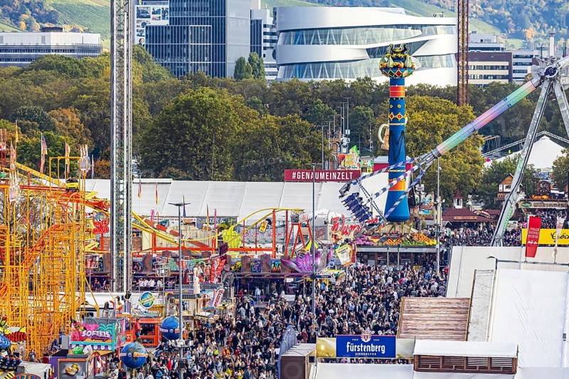 The 178th Cannstatter Volksfest on the Wasen attracted 4.2 million visitors. The Wasenrummel is one of the most important traditional festivals in Germany. In the background is the headquarters of Mercedes-Benz Group AG. Bad Cannstatt, Stuttgart, Baden-Württemberg, Germany