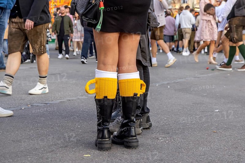 Socks in the shape of a pint of beer. Strange clothing at the Cannstatter Volksfest on the Wasen. Bad Cannstatt, Stuttgart, Baden-Württemberg, Germany