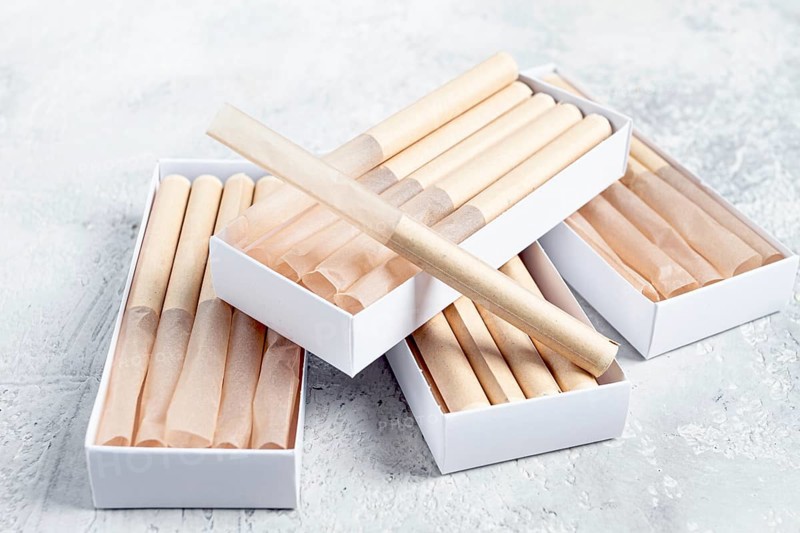 Cigarette casings, packed in boxes, on the table, top view