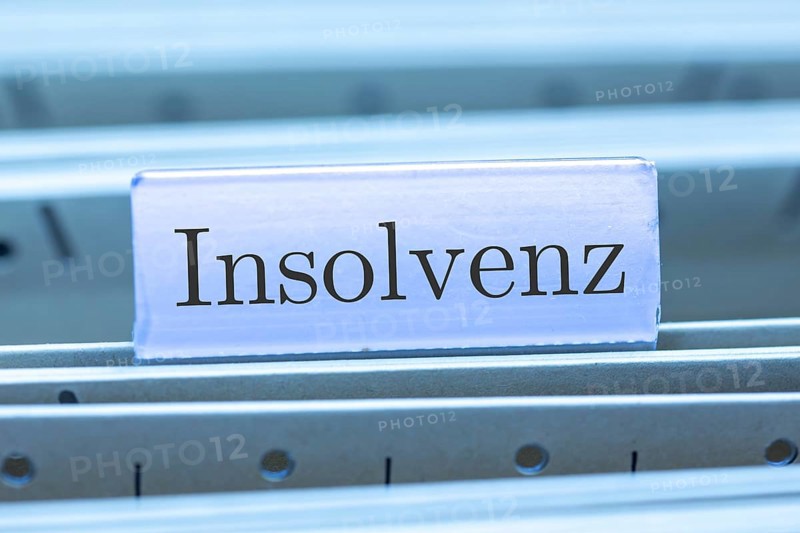 (Photomontage) Sign with the inscription INSOLVENCE on a suspension file folder