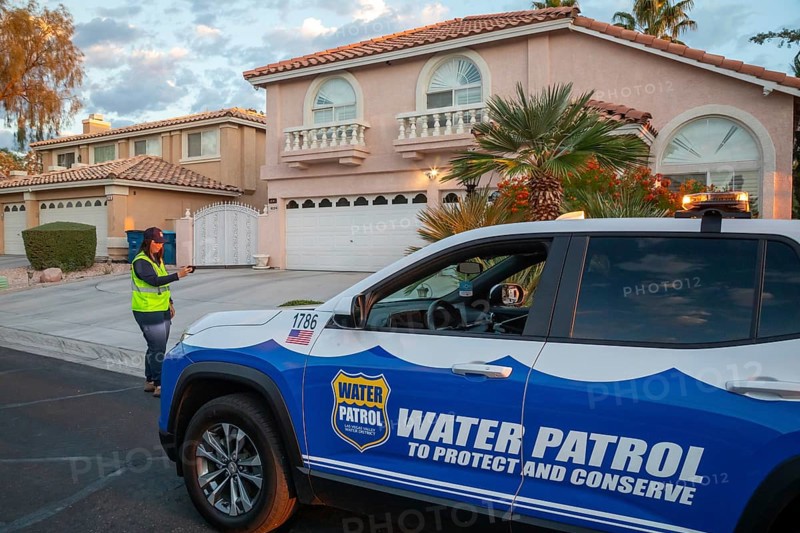 Las Vegas, Nevada - Devyn Choltko, a water waste investigator, patrols a residential neighborhood, recording and issuing tickets for illegal water use. The Las Vegas Valley Water District has cut usage of scarce Colorado River water by more than 30% over the last 20 years despite a growing population