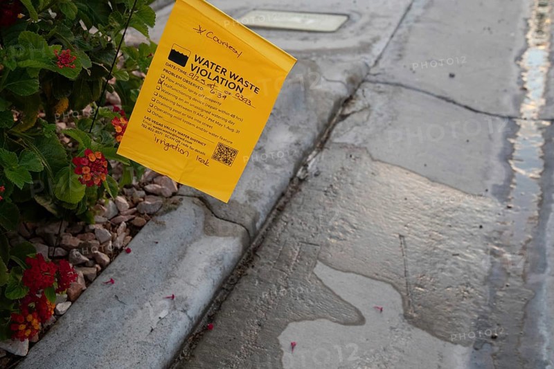 Las Vegas, Nevada - Water waste investigators patrol residential neighborhoods, issuing tickets for illegal water use. The Las Vegas Valley Water District has cut usage of scarce Colorado River water by more than 30% over the last 20 years despite a growing population