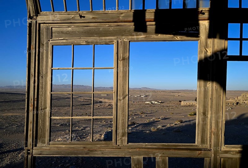 View from a former dwelling house into the desert, Kolmanskop, restricted diamond area, Karas region, Namibia