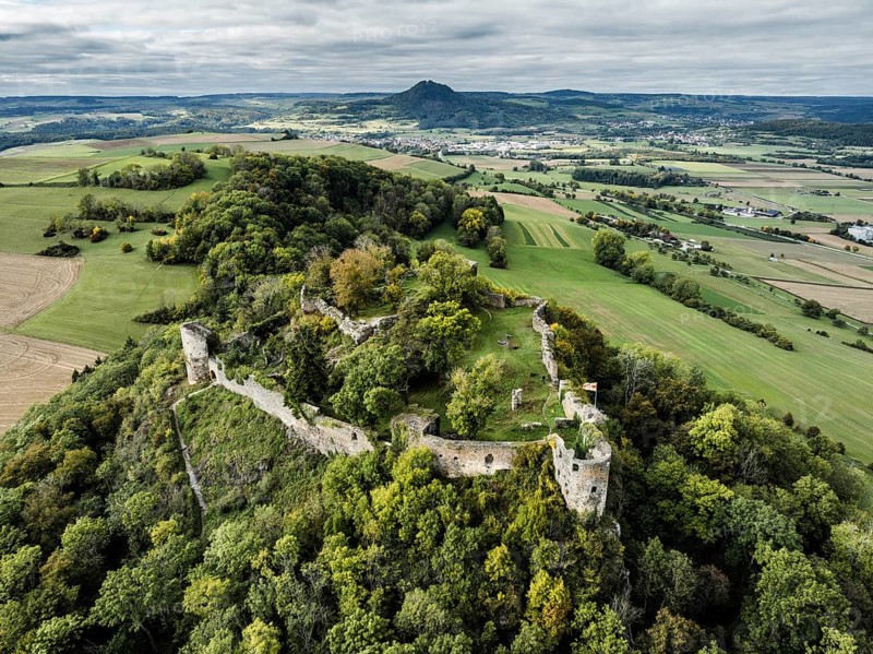 Aerial view of the Hegau volcano and the Mägdeberg castle ruins, with Hohenhewen on the horizon, district of Constance, Baden-Württemberg, Germany