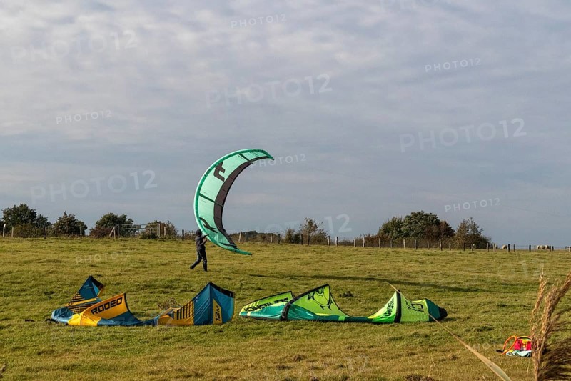 Kitesurfer packing up, Falshöft, Pommerby, Schleswig-Holstein, Germany
