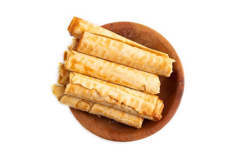 Waffles with caramel isolated on white background, top view, flat lay, close up