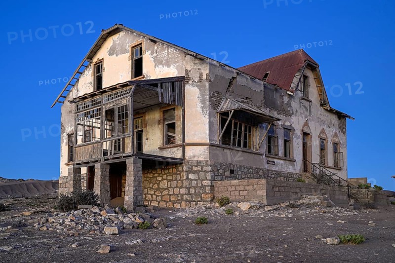 Dilapidated accountant's house in the desert sand, blue hour, Kolmanskop, near Lüderitz, Karas Region, Namibia
