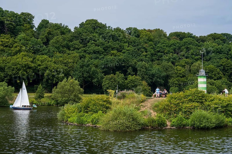 Lighthouse on an island on Lake Kemnader, people on the island, Heveney, Witten, Ruhr area, North Rhine-Westphalia, Germany