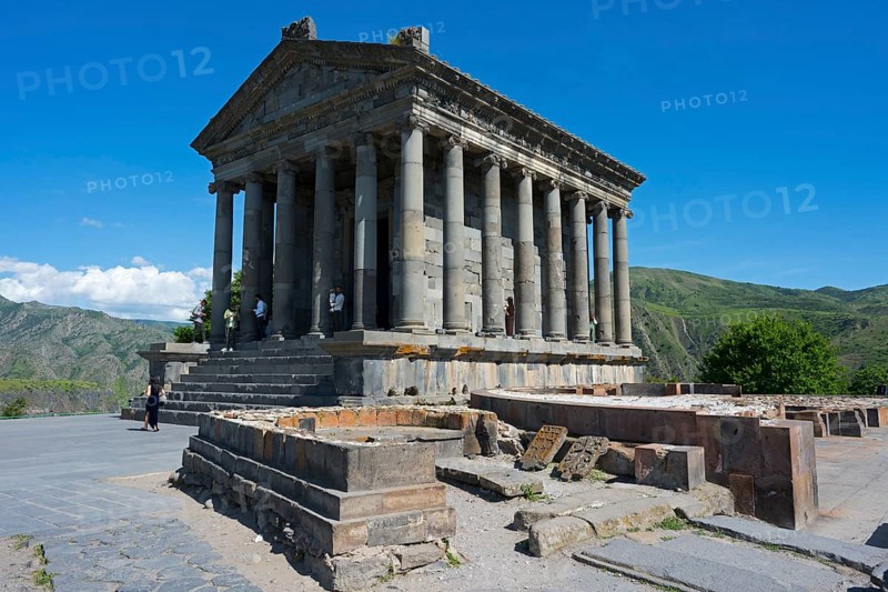Ancient temple with columns in front of a mountainous landscape under a clear sky, Greek-Roman Temple of the Sun, Temple of Garni, Garni, Kotayk Province, Armenia