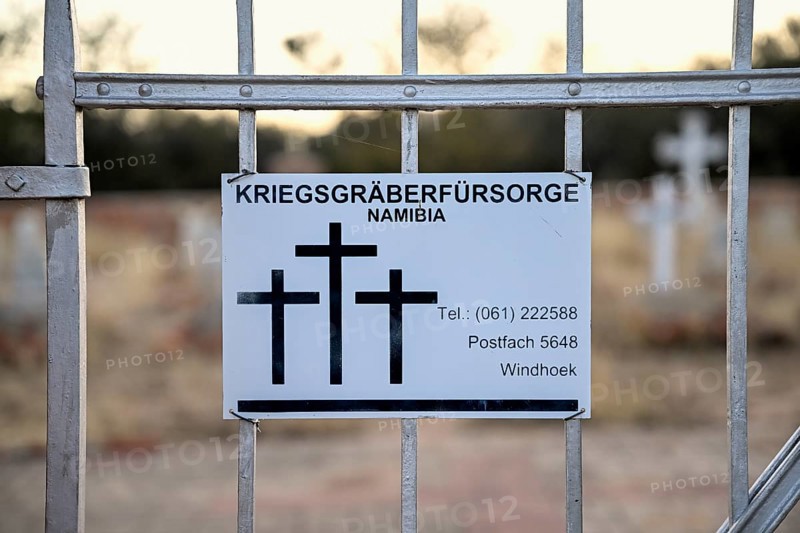 Namibia War Graves Commission sign at the entrance gate to the German military cemetery at Waterberg, Otjozondjupa region, Namibia