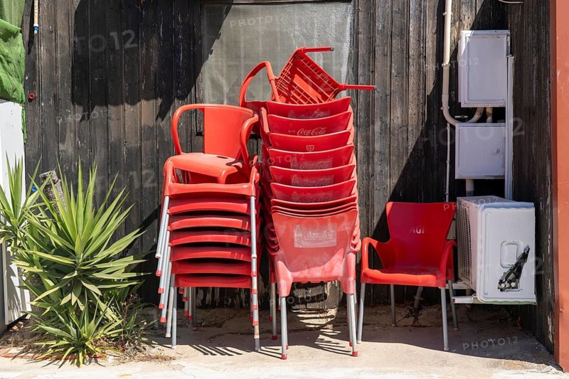 Restaurant furniture, for outdoor catering, tables, chairs, stacked, day off, catering closed, old town of Tavira, Algarve, Portugal