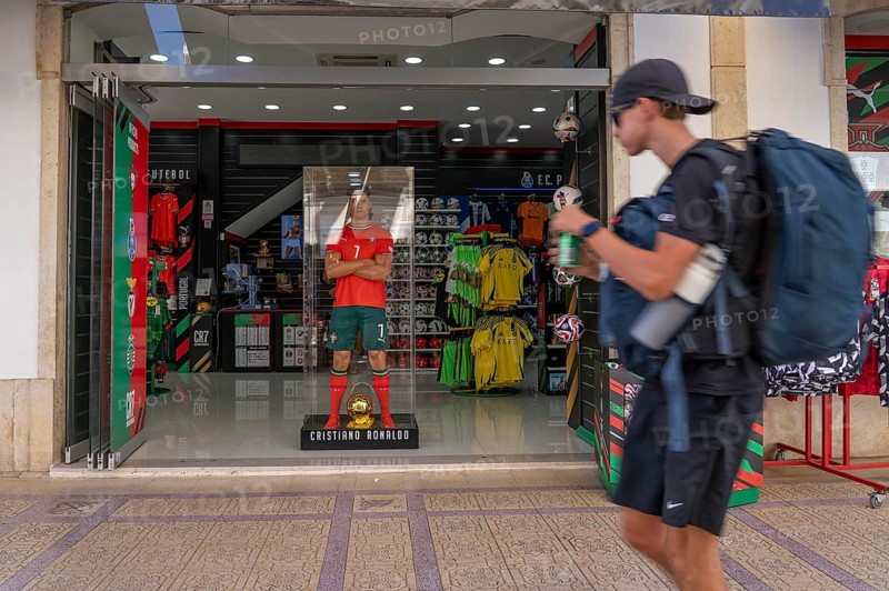 Sports shop, sells merchandise of the Portuguese national football team, various other local football clubs, life-size figure of football star Christiano Ronaldo, CR7, in Vila Real de Santo António, on the border with Spain, Algarve, Portugal
