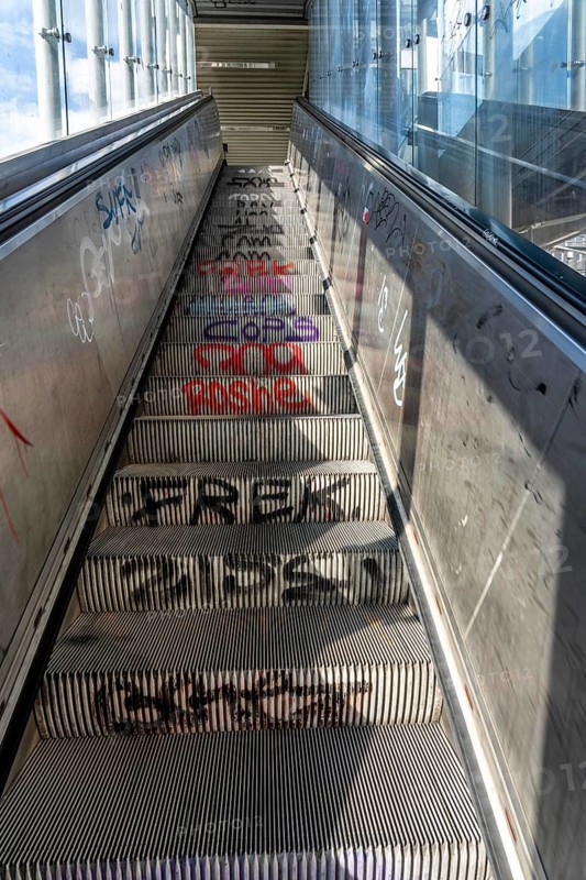 Escalator in a suburban railway station, full of graffiti, Day, Düsseldorf, North Rhine-Westphalia, Germany
