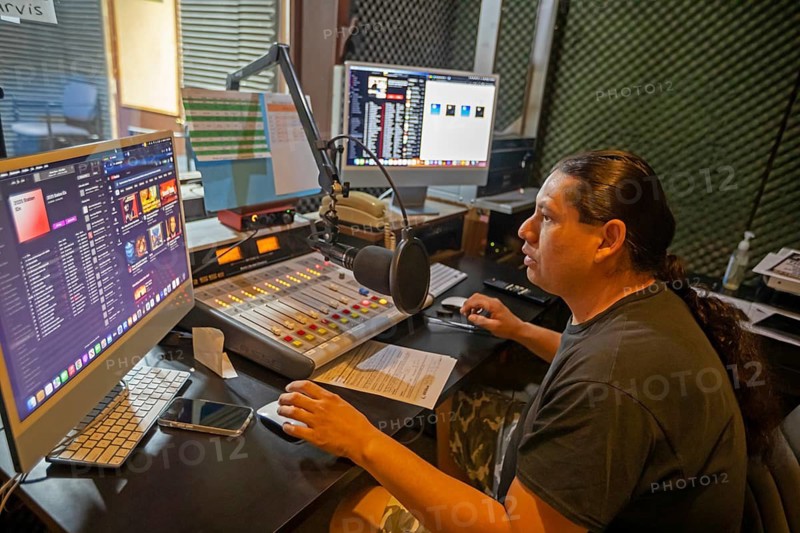Porcupine, South Dakota - Lucian Little White Man broadcasts on KILI Radio, the voice of the Lakota Nation. The station broadcasts in Lakota and English to the Pine Ridge, Cheyenne River, and Rosebud Indian Reservations. Its finances have been hurt by President Trump's dissolution of the Corporation for Public Broadcasting