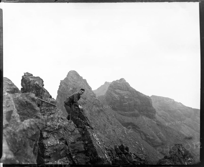 Climber on rocks, Cuillin mountains, Skye, Scotland, UK c 1900-1920 colourised image