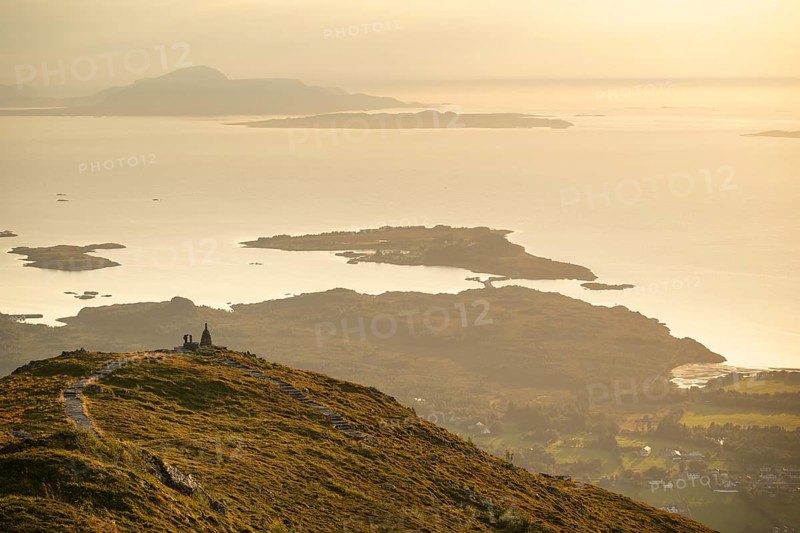 Cairns and view over islands and sea, evening mood, Rørsethornet stone staircase, with 3292 steps one of the longest continuous stone staircases in the world, Sherpat staircase or Midsund staircase or Midsundtrappene, Rørsethornet hike, Otroya or Otrøya island, Møre og Romsdal, Norway
