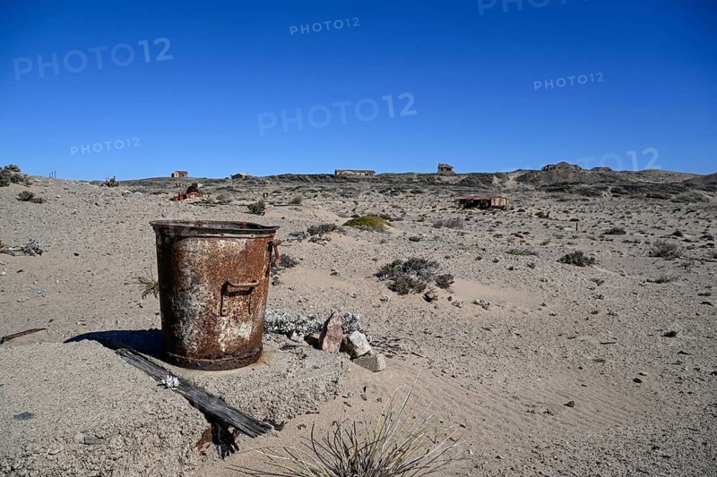 Rusted bucket in the desert sand, Pomona, restricted diamond area, near Lüderitz, Karas region, Namibia