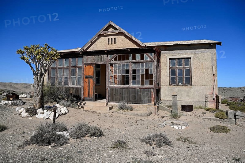 Dilapidated building in the desert sand, Pomona, restricted diamond area, near Lüderitz, Karas region, Namibia