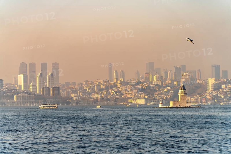 The Maiden Tower lighthouse, Leander Tower or Maiden Tower in front of the skyline of Istanbul, Turkey