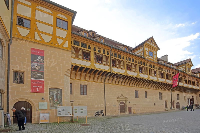 Inner courtyard of Hohentübingen Palace, half-timbered house with arcade, entrance, museum pedestrian, Tübingen, Neckar Valley, Baden-Württemberg, Germany