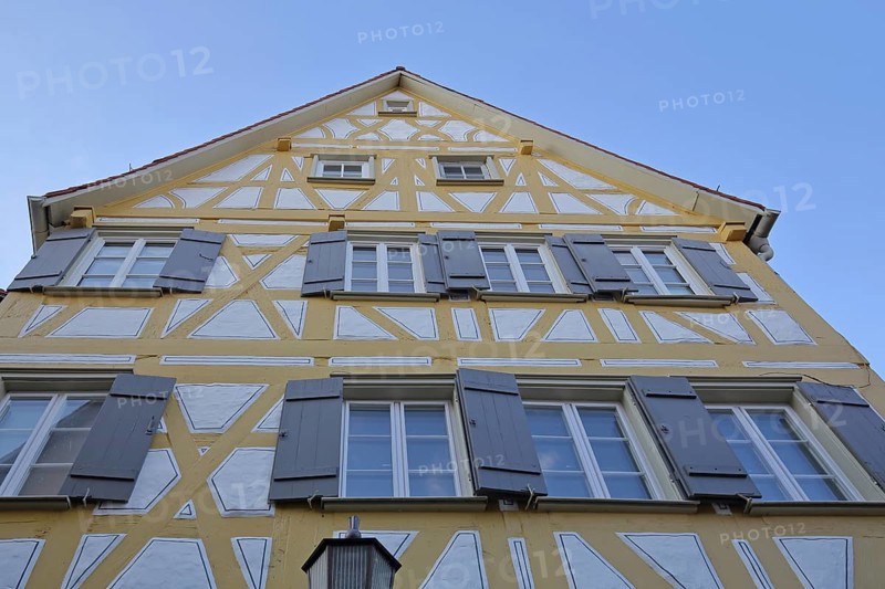 Yellow half-timbered house with shutters, gable, view upwards, Staig Rottenburg am Neckar, Neckar Valley, Baden-Württemberg, Germany