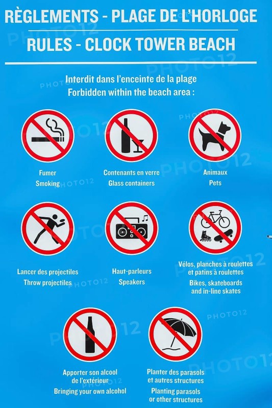 Posted rules sign with pictograms showing various restrictions at Clock Tower Beach, Old Port of Montreal, Quebec, Canada